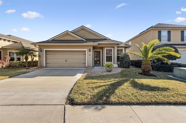 view of front of property featuring a garage and a front lawn