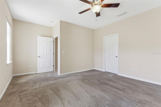 carpeted empty room with ceiling fan