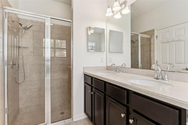 bathroom featuring an enclosed shower and vanity