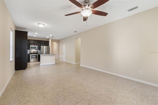 unfurnished living room with ceiling fan and light tile patterned floors