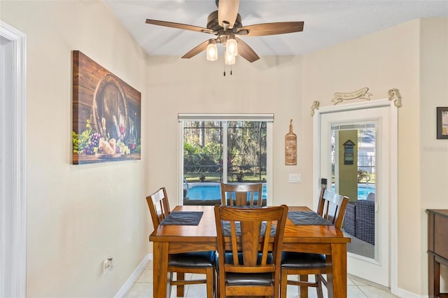 dining room featuring ceiling fan and light tile patterned floors