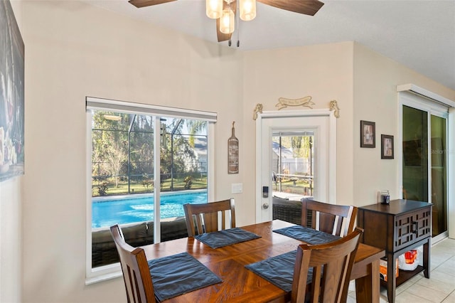 dining area with ceiling fan, plenty of natural light, and light tile patterned floors