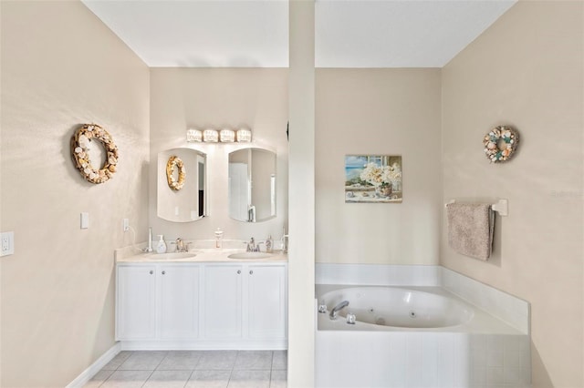 bathroom featuring tile patterned flooring, tiled tub, and vanity