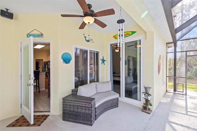 view of patio / terrace featuring ceiling fan and a lanai