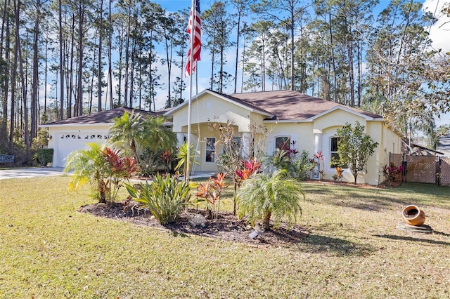 single story home featuring a garage and a front lawn