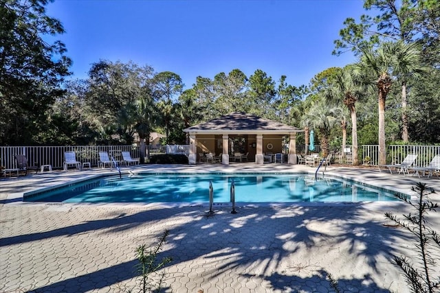 view of swimming pool with a patio area