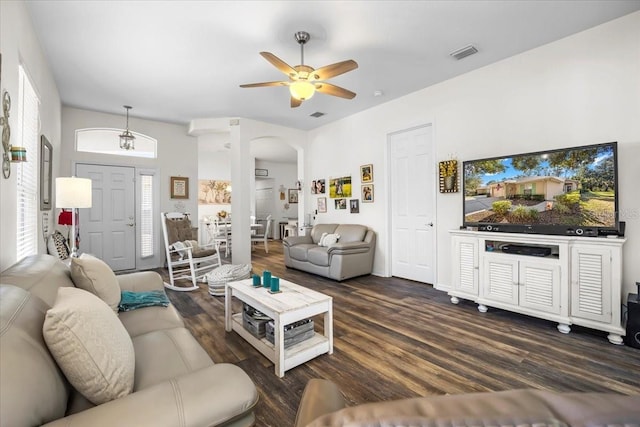 living room with ceiling fan and dark hardwood / wood-style floors