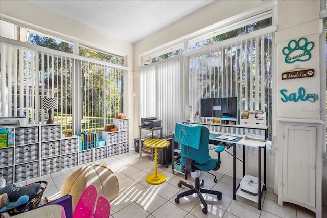 tiled office featuring a healthy amount of sunlight