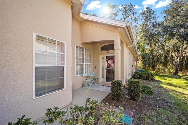 entrance to property with a yard