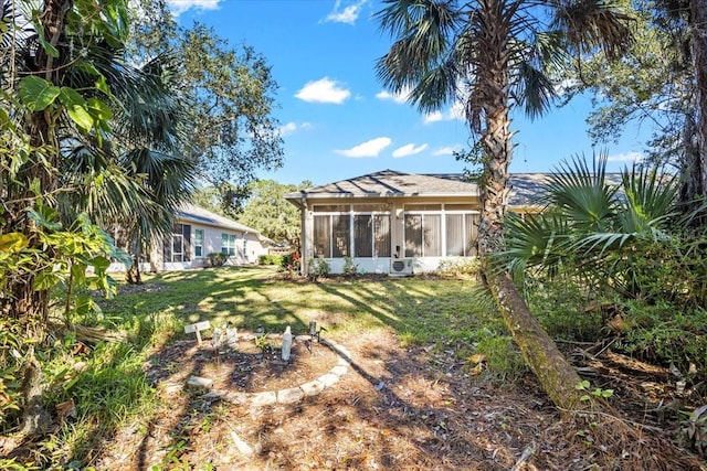 view of yard with a sunroom