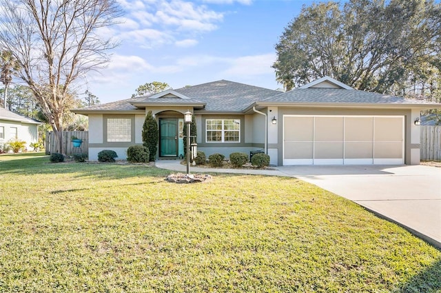 ranch-style house featuring a front yard and a garage