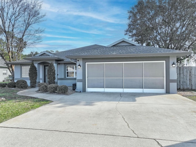 ranch-style home featuring a garage