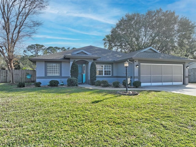 ranch-style home with a front yard and a garage