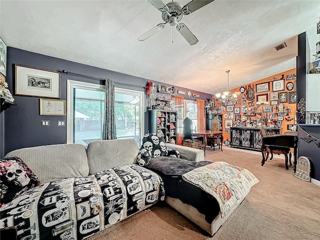 carpeted living room featuring ceiling fan with notable chandelier, lofted ceiling, and a textured ceiling