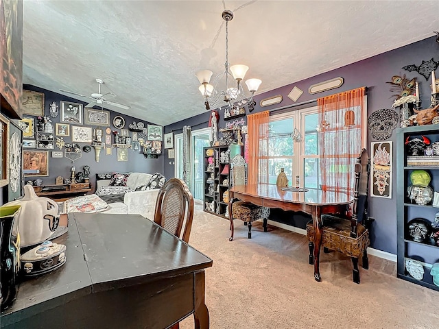 dining room with carpet flooring, a textured ceiling, ceiling fan with notable chandelier, and vaulted ceiling