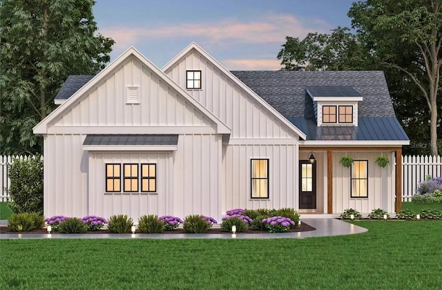 modern farmhouse style home with a yard