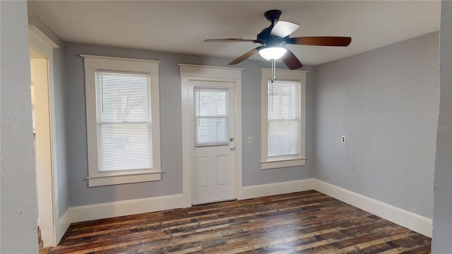 interior space with ceiling fan and dark wood-type flooring