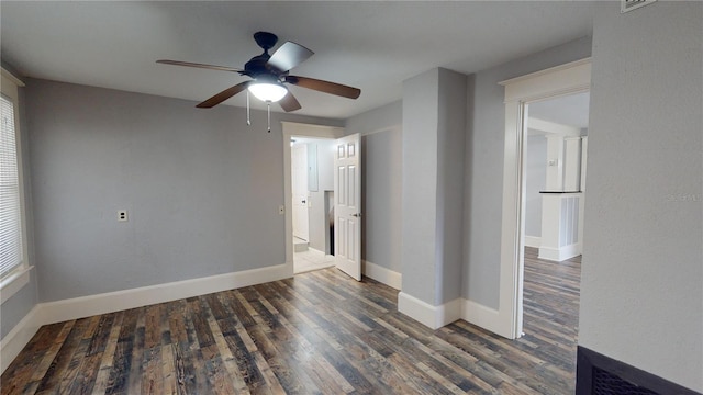 spare room with ceiling fan and dark hardwood / wood-style flooring