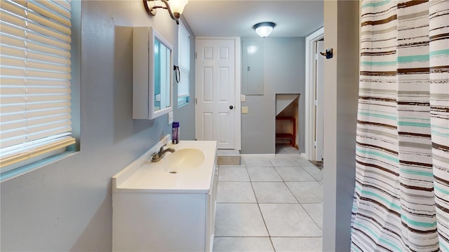 bathroom with tile patterned flooring and vanity