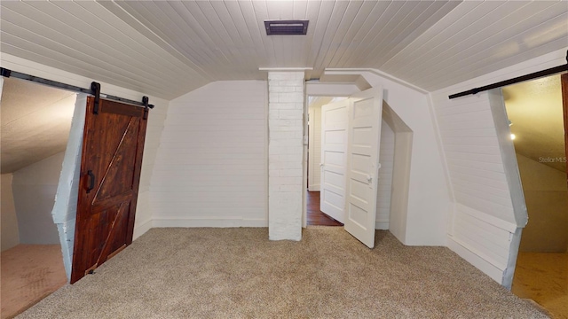 bonus room with carpet flooring and lofted ceiling