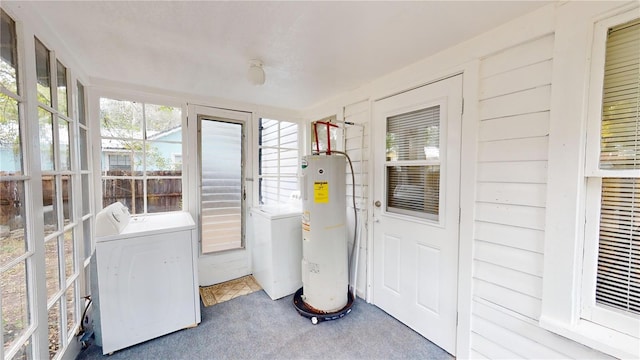 sunroom / solarium with washer and clothes dryer and water heater