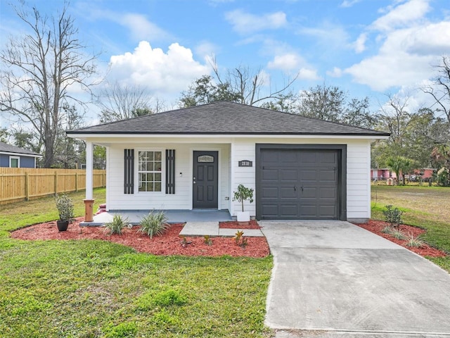 view of front of house with a porch, a garage, and a front yard