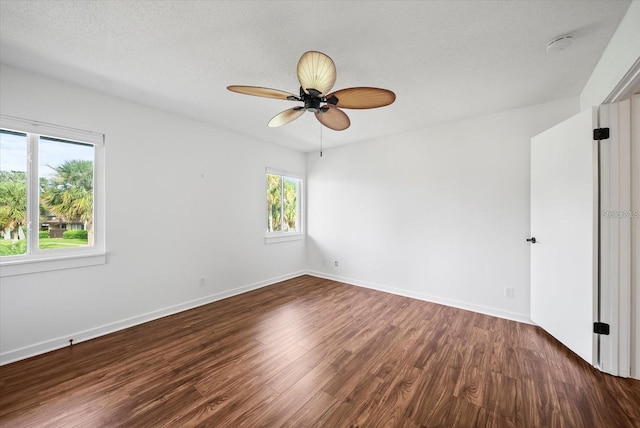 empty room featuring ceiling fan and hardwood / wood-style flooring