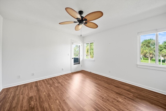 empty room featuring ceiling fan and wood-type flooring