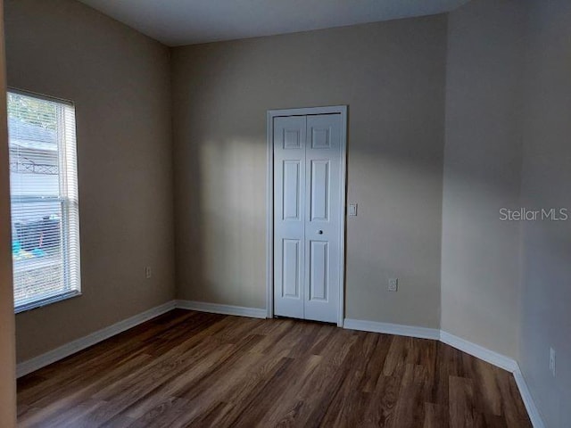 empty room featuring dark hardwood / wood-style floors