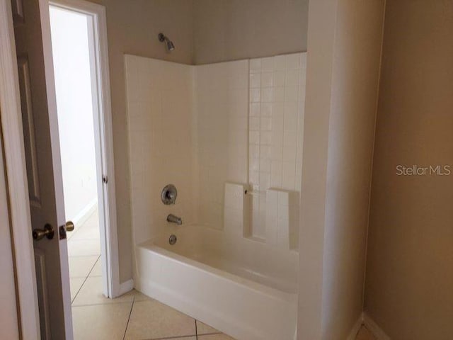 bathroom with shower / washtub combination and tile patterned flooring