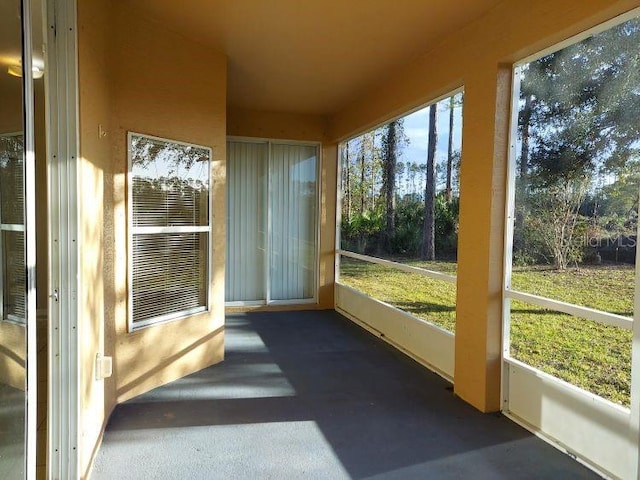 unfurnished sunroom featuring a wealth of natural light