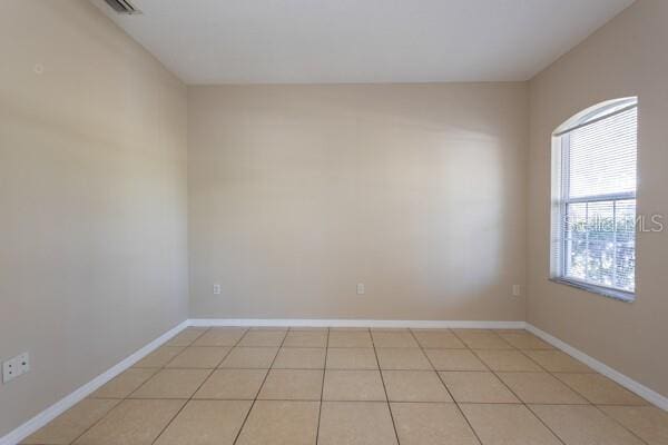 view of tiled spare room