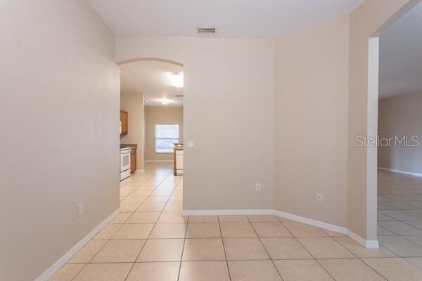 unfurnished room with light tile patterned floors