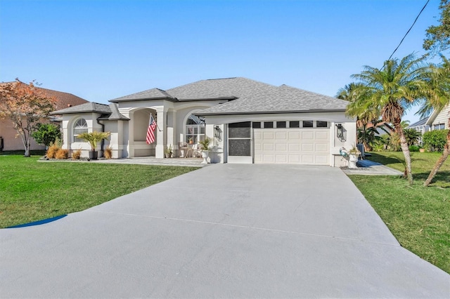 view of front facade featuring a garage and a front lawn