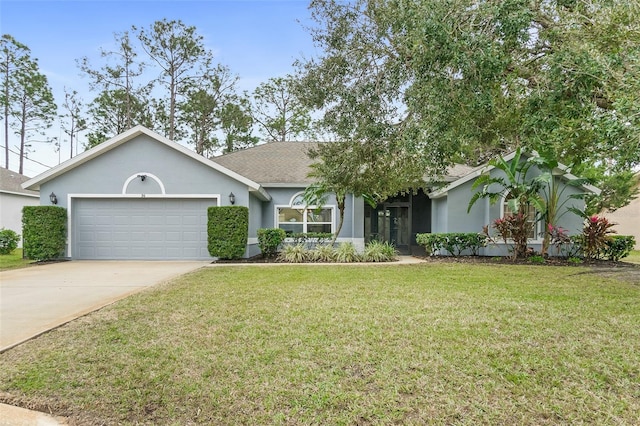 single story home featuring a garage and a front lawn