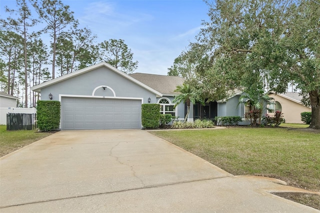 view of front of property featuring a garage and a front yard