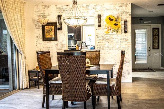 dining area featuring hardwood / wood-style flooring and sink