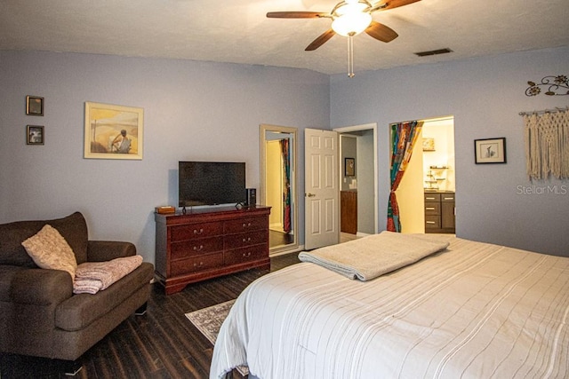 bedroom featuring ensuite bath, ceiling fan, and dark wood-type flooring