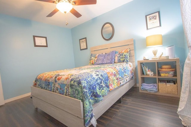 bedroom featuring ceiling fan and dark hardwood / wood-style floors