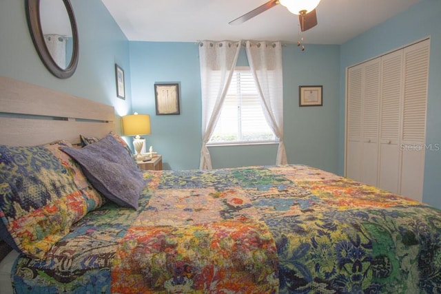 bedroom featuring ceiling fan and a closet