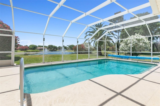 pool featuring a lanai, a water view, and a patio