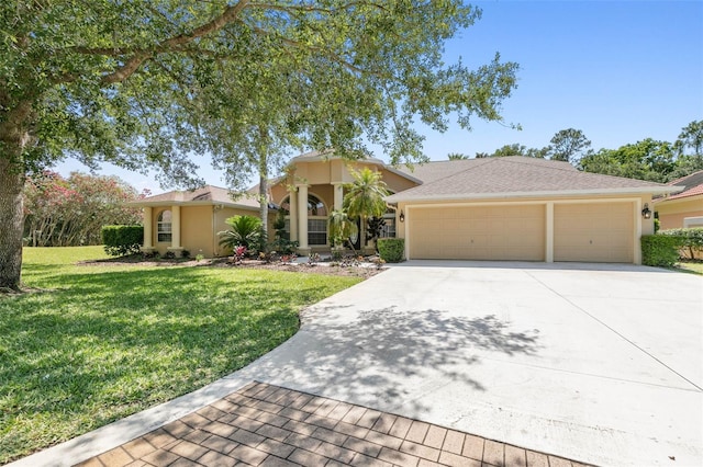 view of front of home featuring driveway, stucco siding, an attached garage, and a front yard