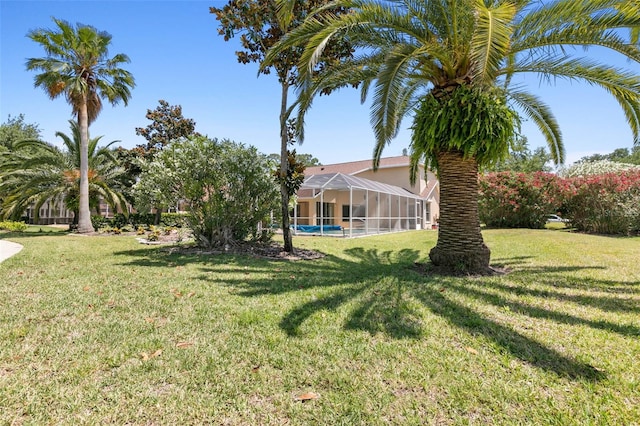 view of yard featuring a lanai