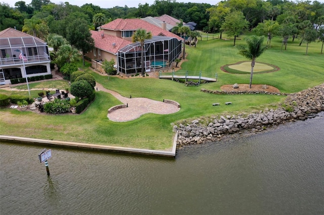 birds eye view of property featuring a water view and view of golf course