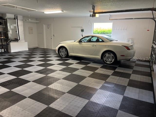 garage featuring heating unit