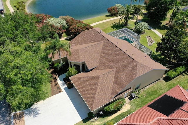 birds eye view of property with a water view