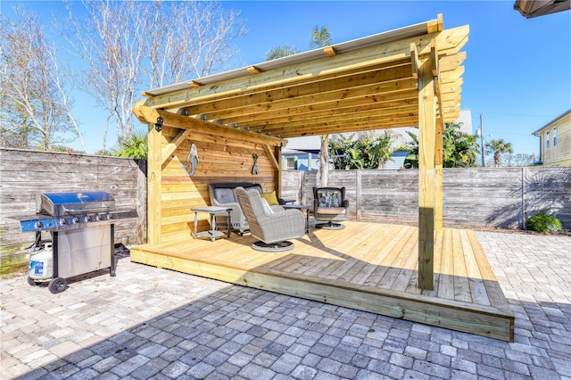 view of patio featuring grilling area and a wooden deck