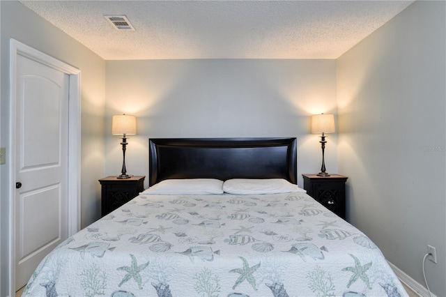 bedroom featuring a textured ceiling