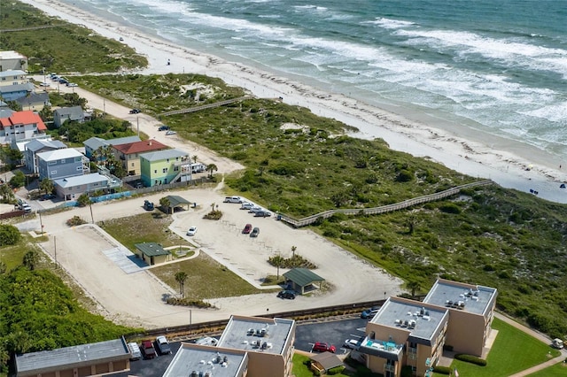 bird's eye view featuring a beach view and a water view