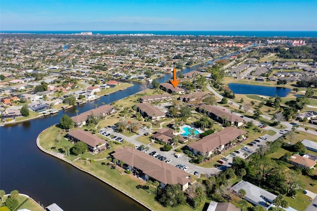 bird's eye view with a water view